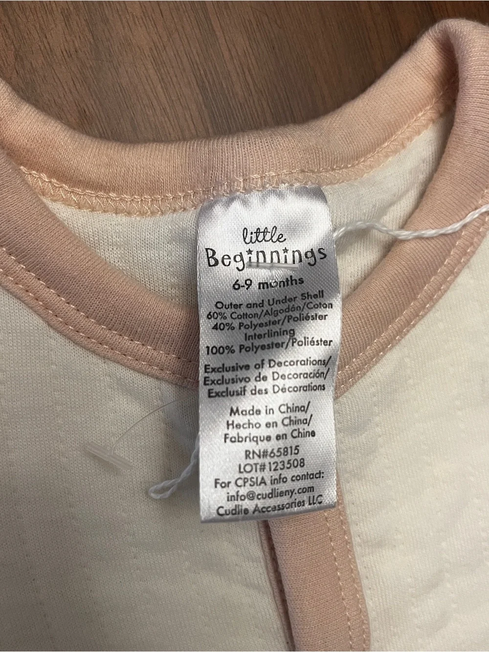 Cream Baby Footed One-Piece with Beige Trim and Sleeping Bear